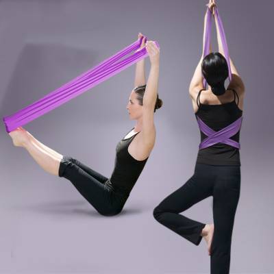Ballet dance foot-back gymnastics. Yoga rope stretch with a body-pump belt rubber