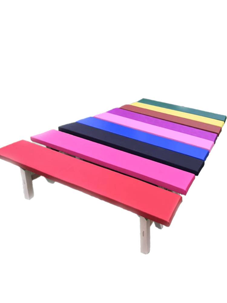 The factory's straight-up choreographer dances the leg and gymnastics stools