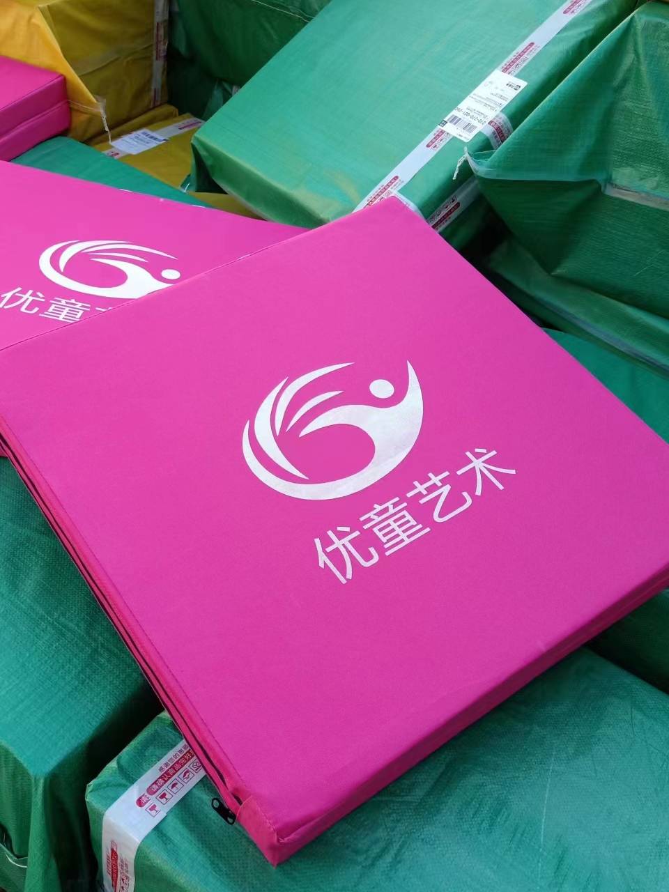 With thick dancing mats and gym pads, adults folded dance pads and practiced grafts