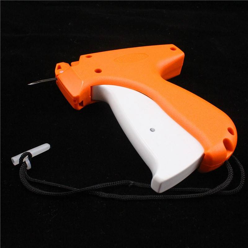 The new tag gun fine needle hit the tag label grabbing gum, the trademark gun socks the label machine