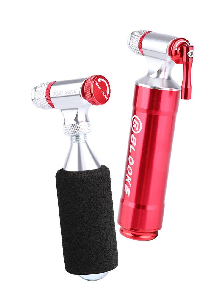 THE BLOOKE ROCK QUICK INFLATER MOUNTAIN ROVER IS FILLED WITH A BICYCLE TO PUMP CO2 CYLINDERS