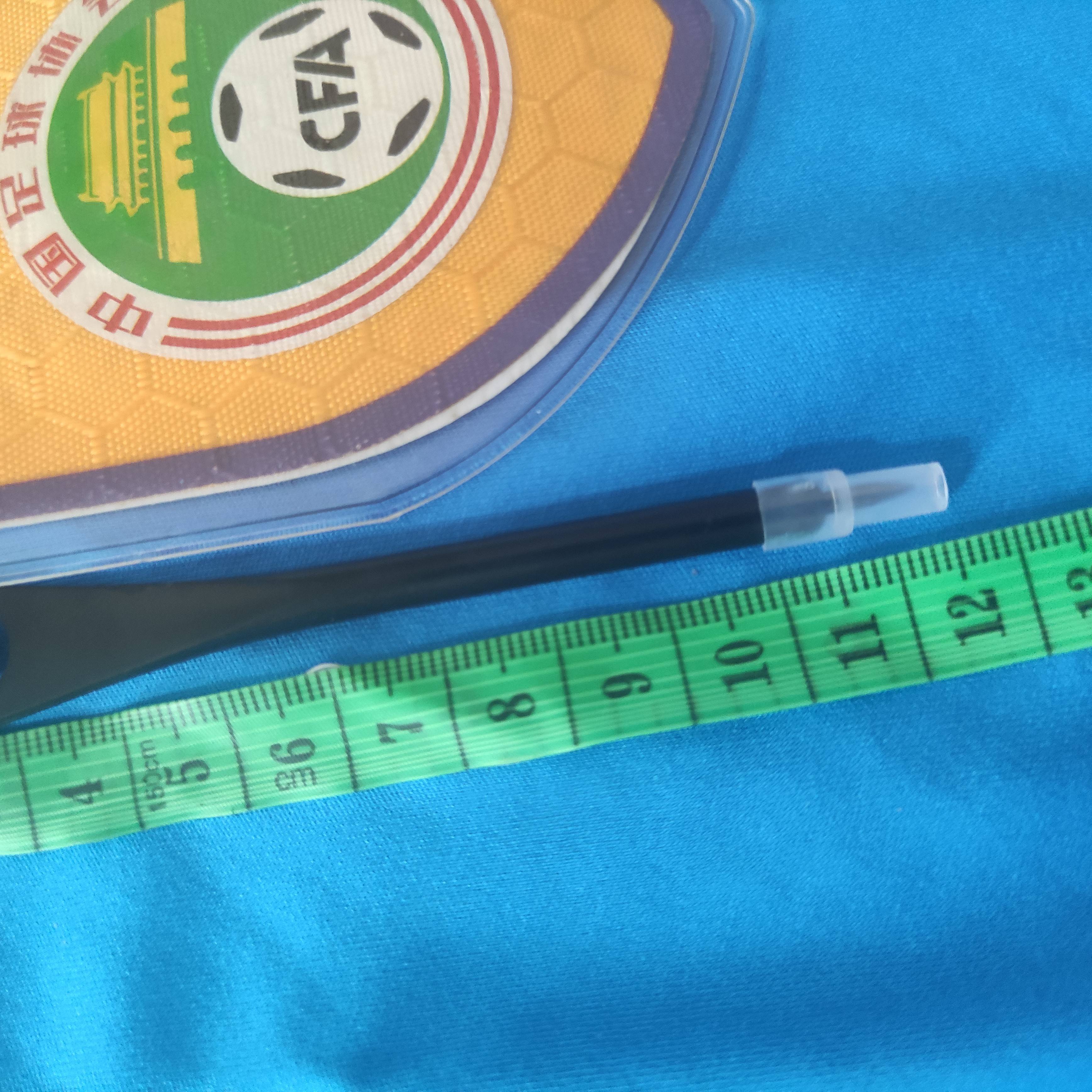 # football judges with referee props and pencils