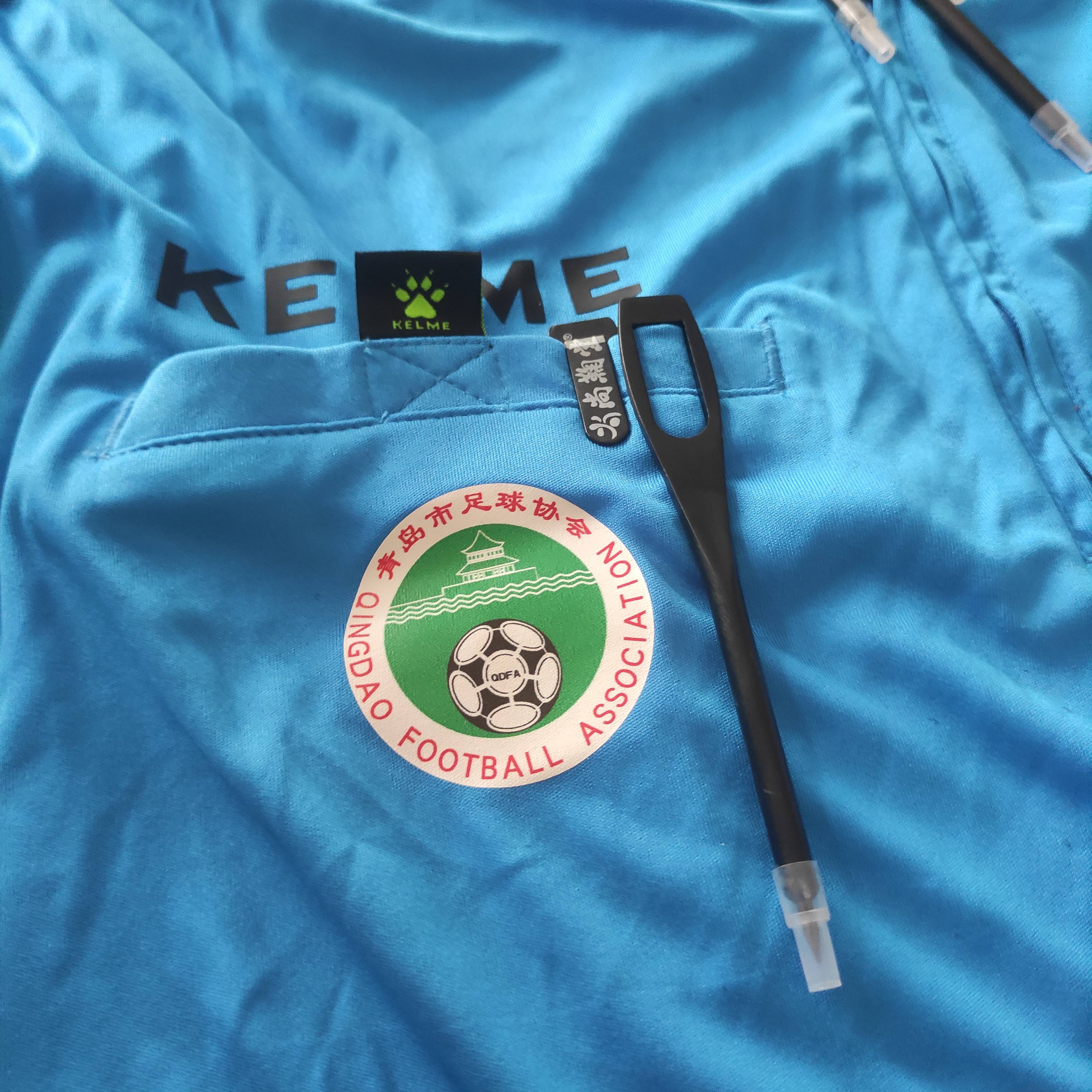 # football judges with referee props and pencils