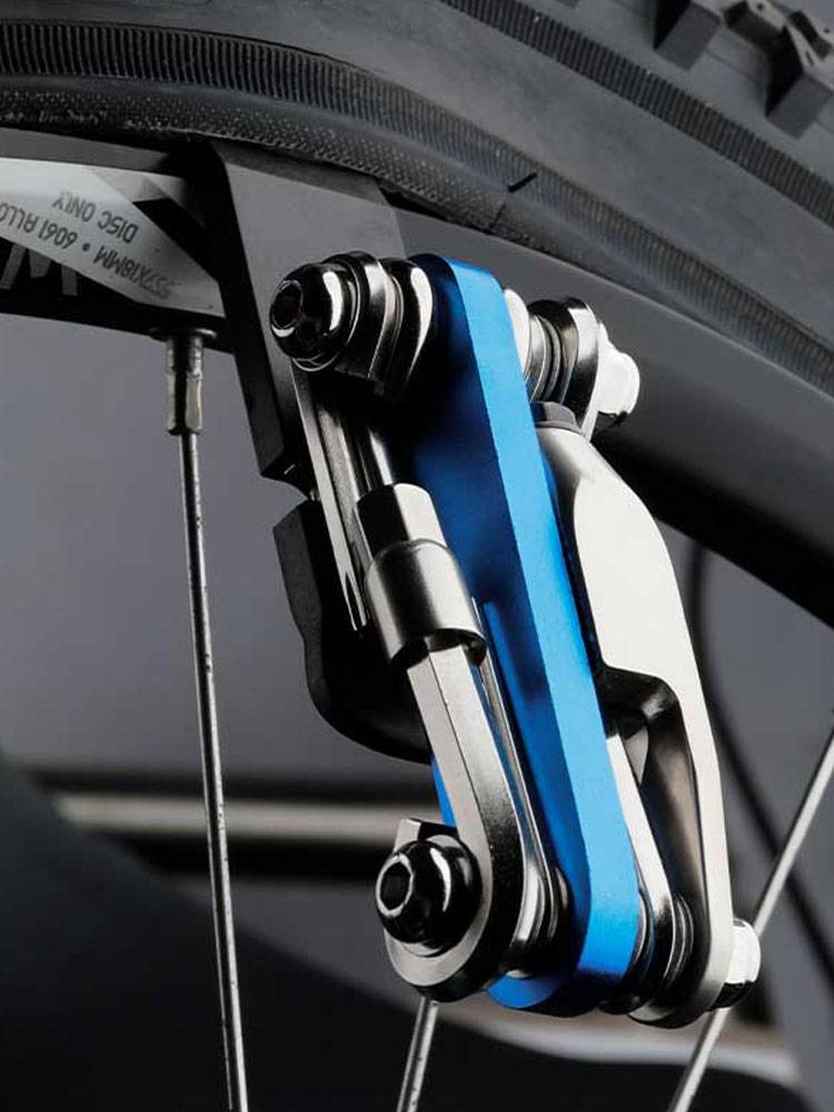 A bicycle multifunctional combination carries a chain-tracker for a tire rod and a bike repair wrench