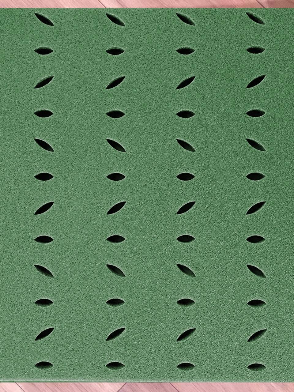 AN ARTIFICIAL LAWN-BREATHING XPE SUCTION ELASTIC PAD AT THE FOOTBALL FIELD