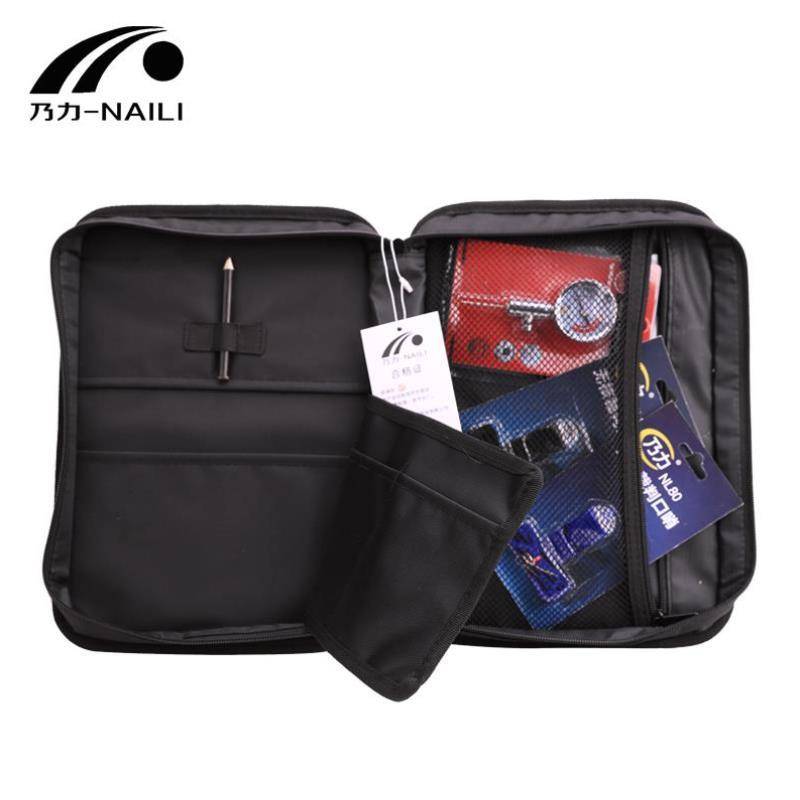 The referee's soccer bag, the referee's kit, the referee's red and yellow air pressure table picker