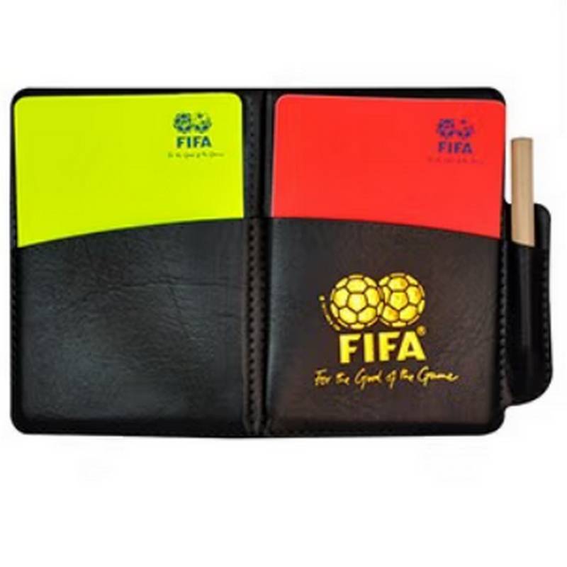 The referee uses a red and yellow card to pick the edges and cut the flags