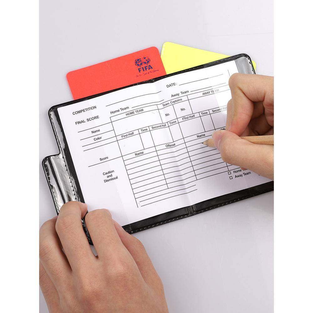 Soccer judge's red yellow card with a pen-picking juckey