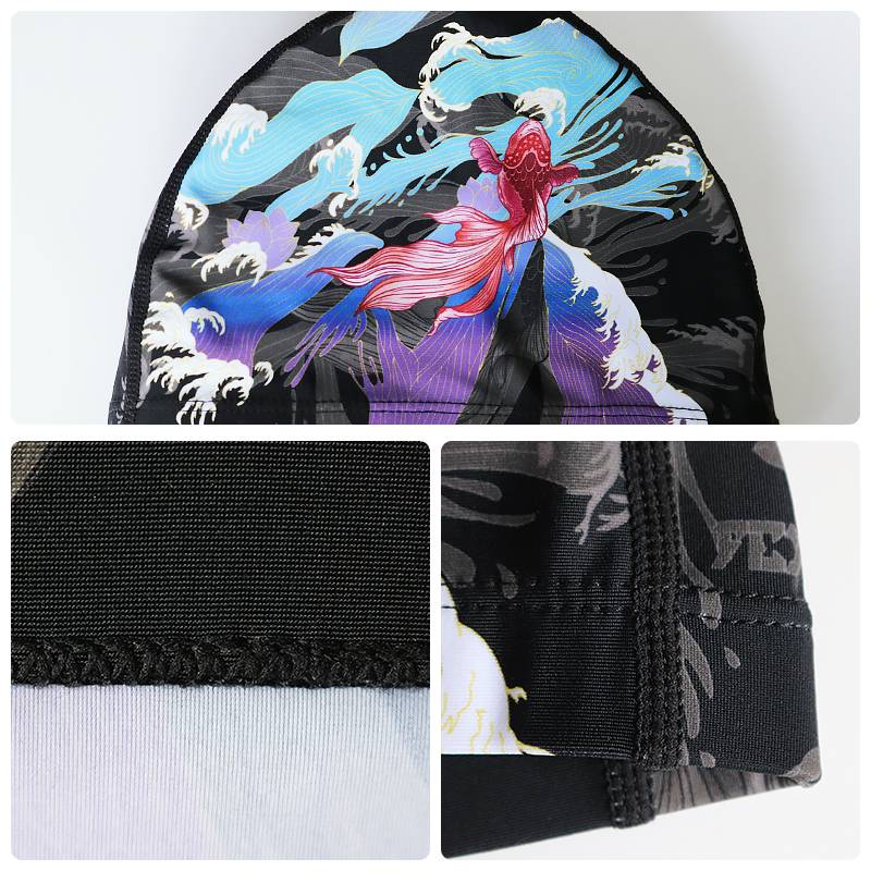 Flying Fish Future Swimming Hat. Men and women with long hairs on top of their big, cosmopolitan, adult swim hats