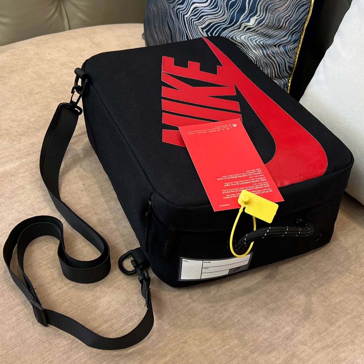 Black and red crossbody model