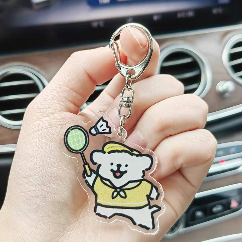 Cute high -value line puppy sports will play table tennis badminton basketball swimming keychain pendant around the puzzle games