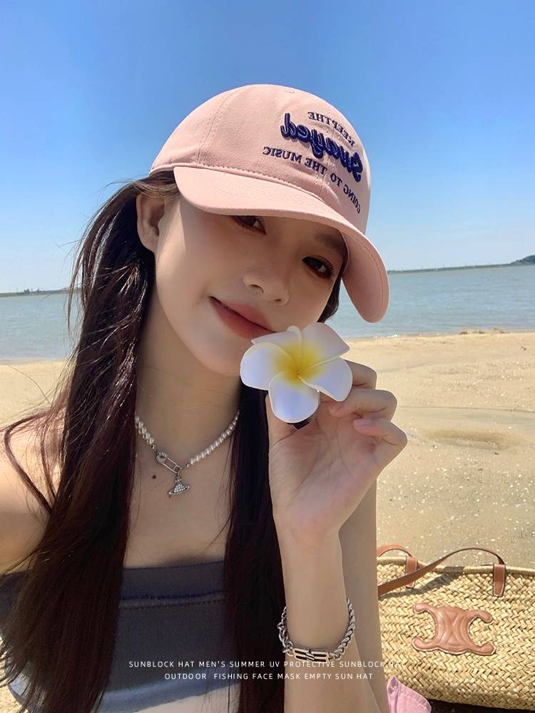The duck tongue cap girl, 2024, with a big head in the sun-covered wide cap baseball hat