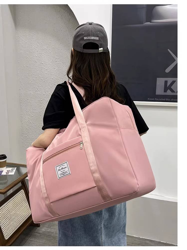 Large -capacity Travel Breakthrough Lifting Bubble Women's Wide Wide Waterproof Luggage Bag Male Short -distance Disposal Travel Breeding Package