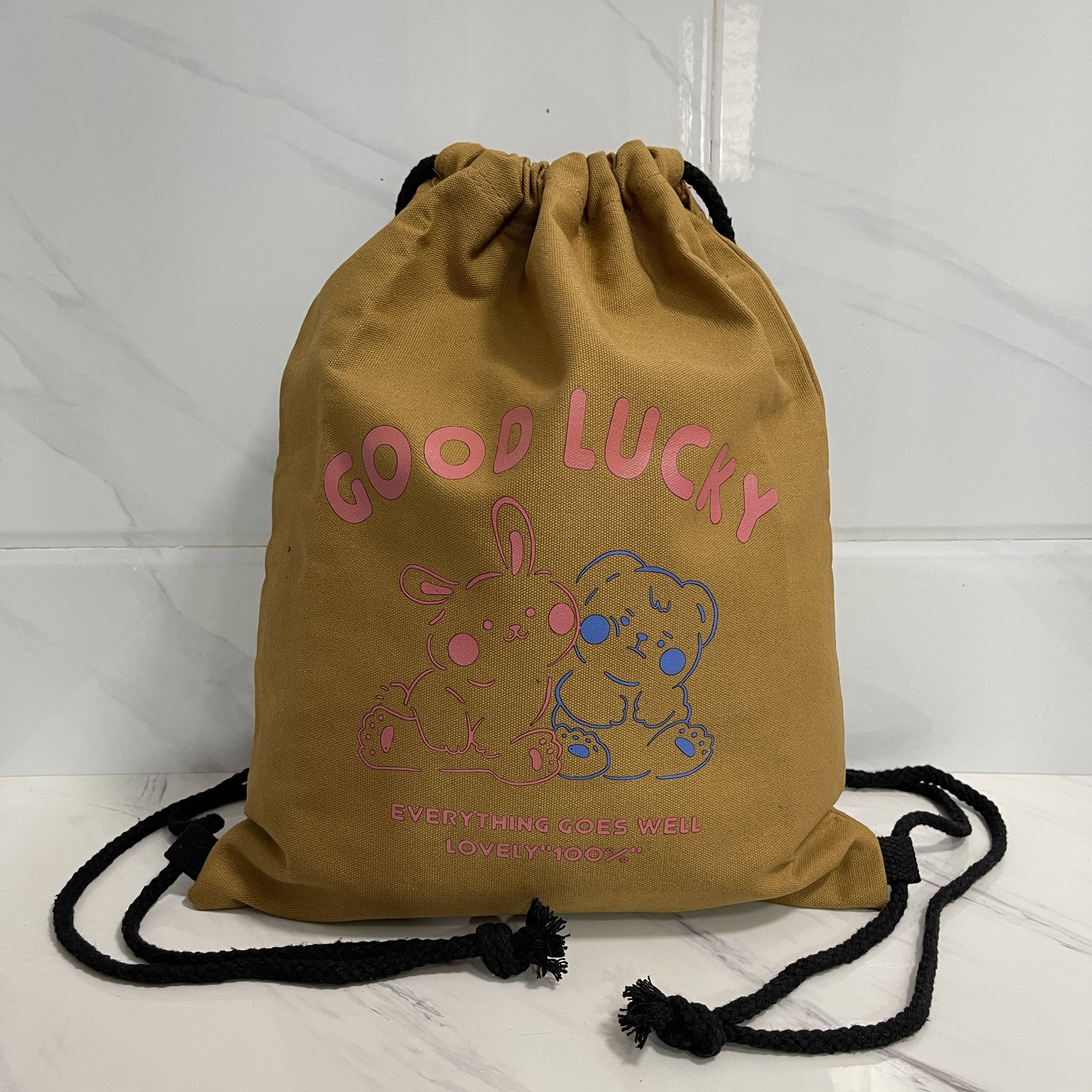 Coffee-coloured bear-rabbit with a seven basketball