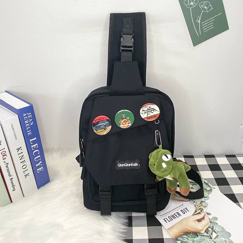 Black + 3 badges + dinosaur hanging