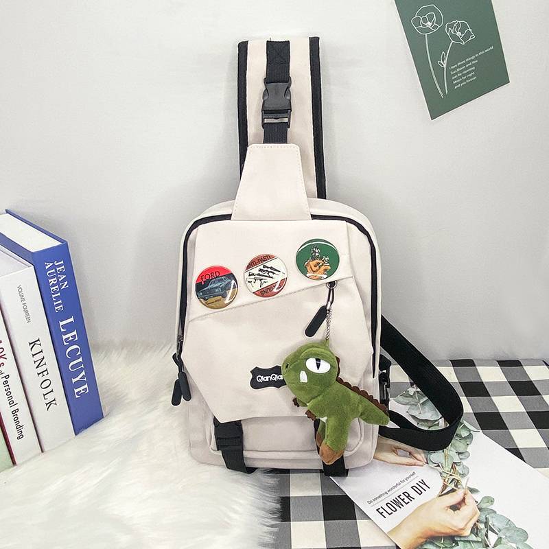 White + 3 badges + dinosaur hanging