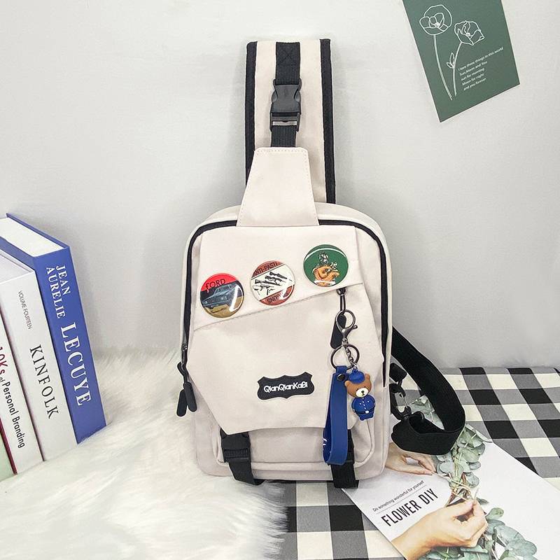 White + 3 badges + cartoon blue bear hanging