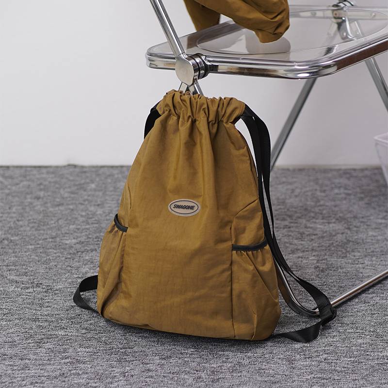 Pumping rope Backpack female 2024 new beam pocket sports lightweight backpack travel bag men's outdoor minimalist backpack