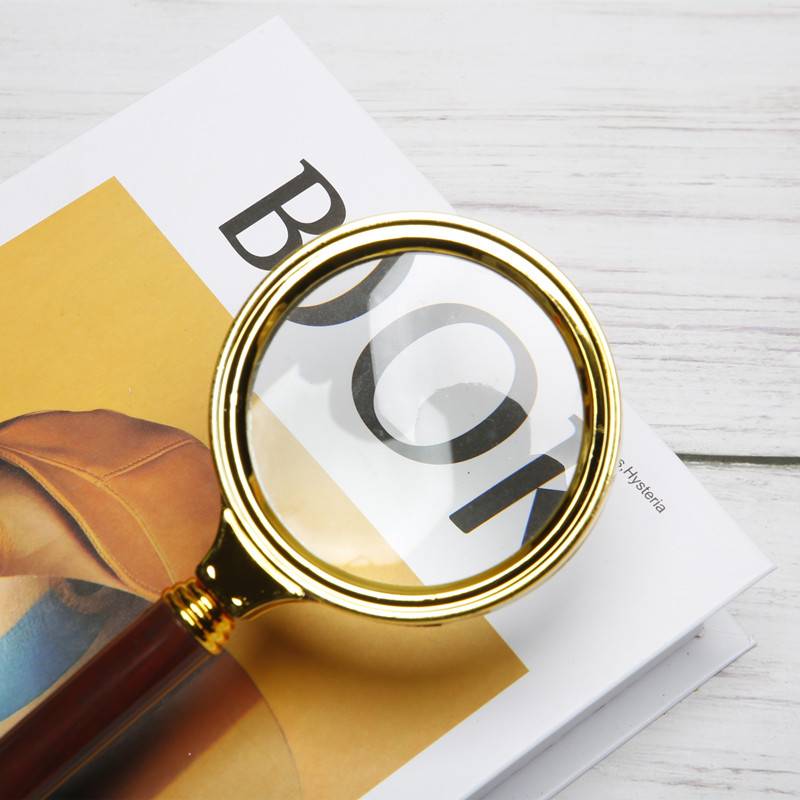 Old people with high-resolution magnifiers read child magnifiers with magnifiers to take photographs of the prop