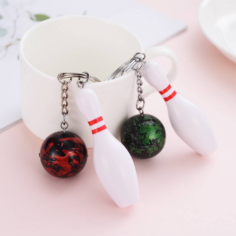 Mini-baby key buttons attached to a bowling kit for a souvenir