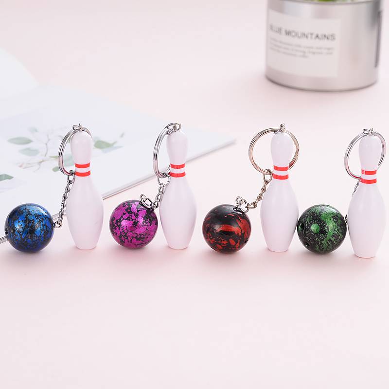 Mini-baby key buttons attached to a bowling kit for a souvenir