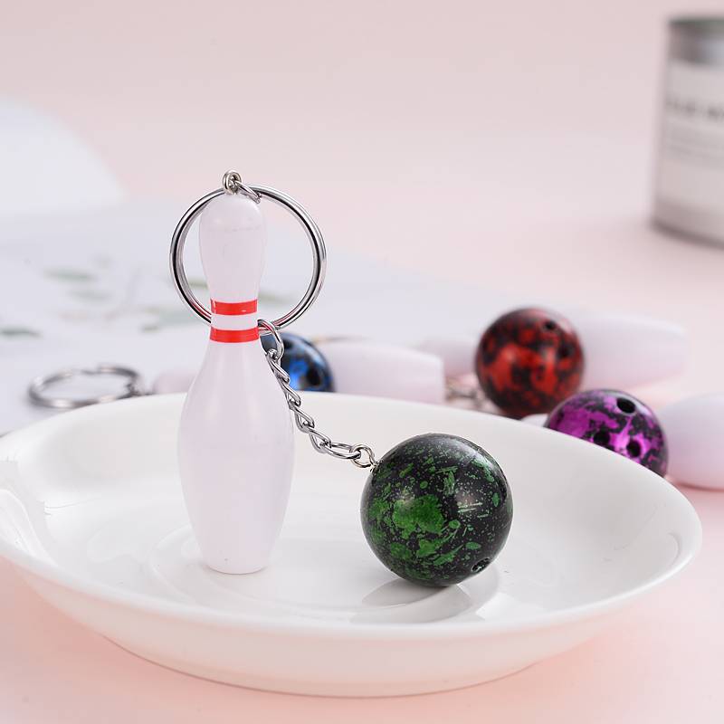 Mini-baby key buttons attached to a bowling kit for a souvenir