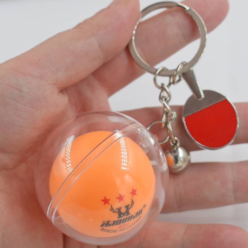 The racket keychain plus yellow table tennis