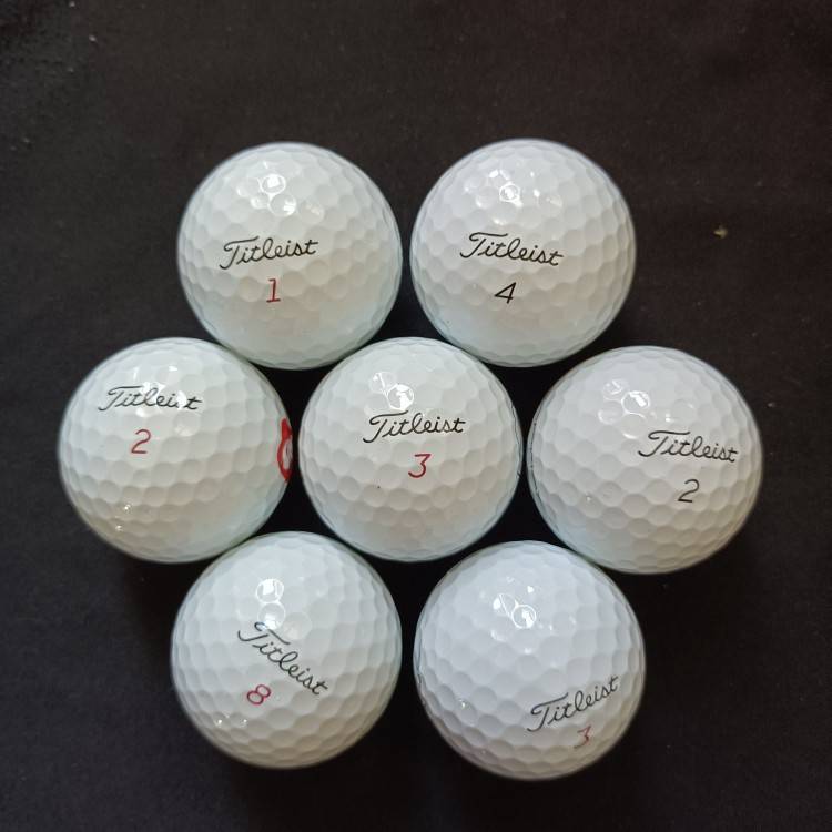 White Titleist three or four floors 8-9 % new 50