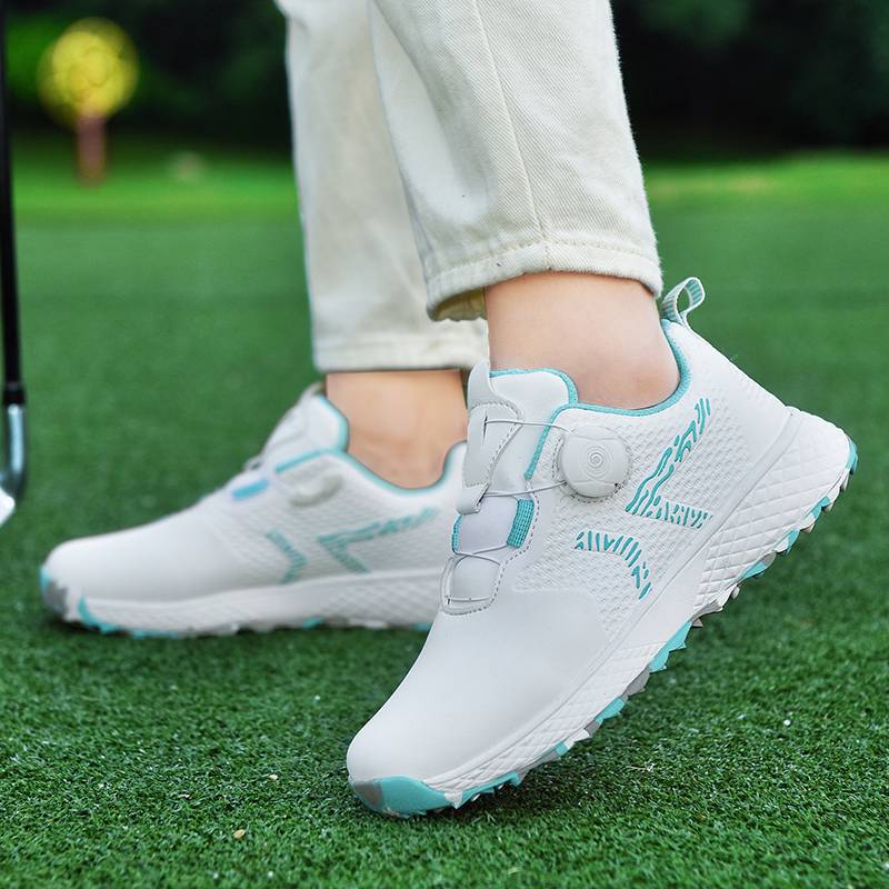 The new lady rotates the golf shoes outside of the house