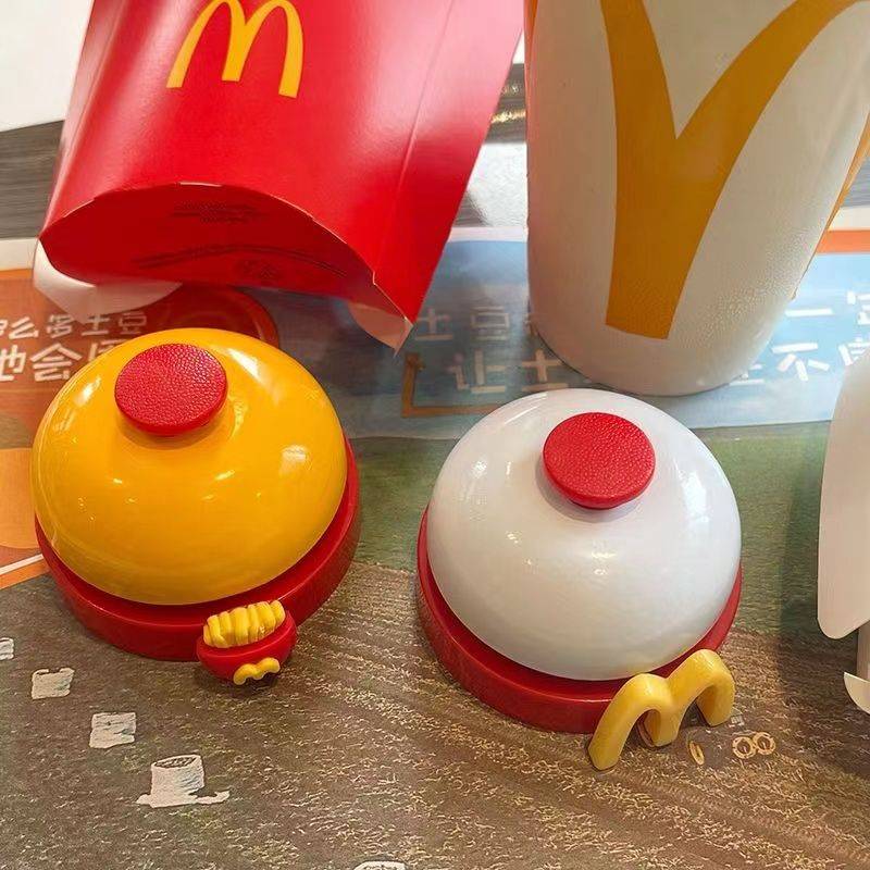 McDonald's Bell Hand presses the campaign on the front desk of the artifact on the bell on the front desk of the artifact.