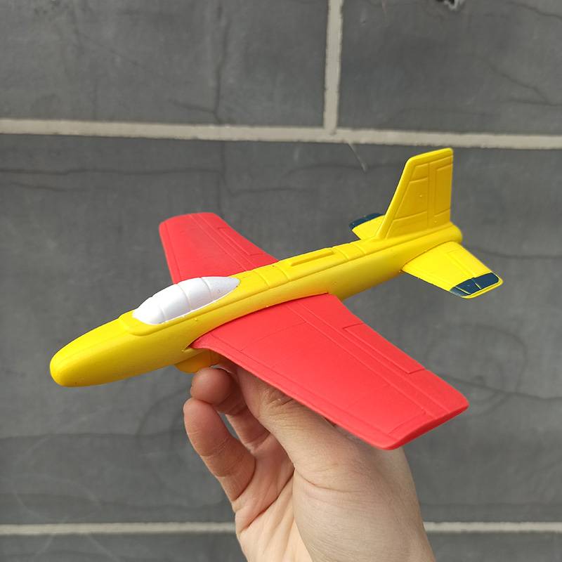 Red and yellow hand throwing small planes