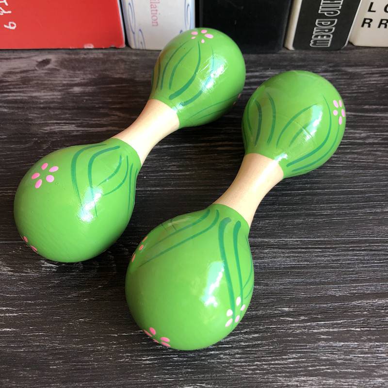 Two small green double -headed sand balls