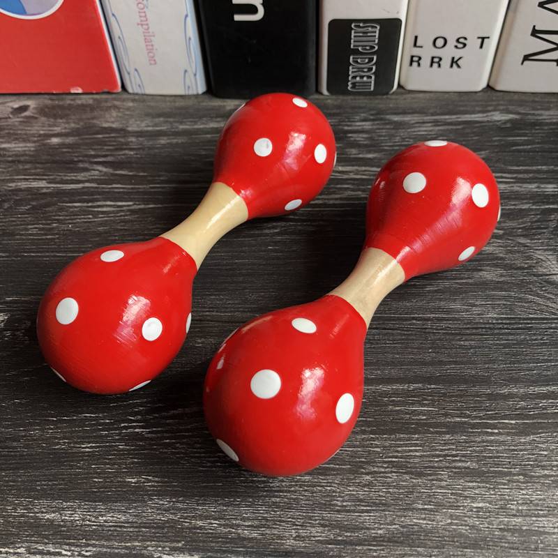 Two red double -headed sand balls
