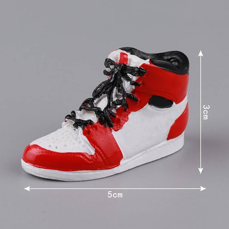 Five red and white resin basketball sneakers
