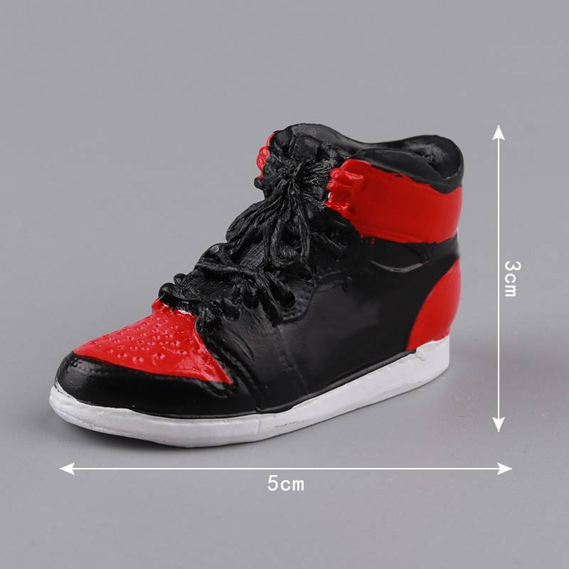 5 red and black resin basketball sneakers