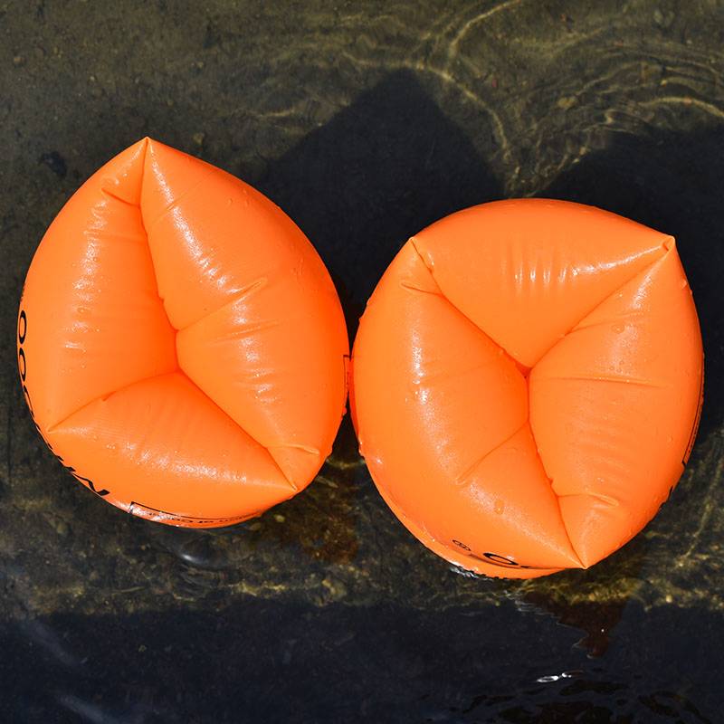 A pair of orange water sleeves