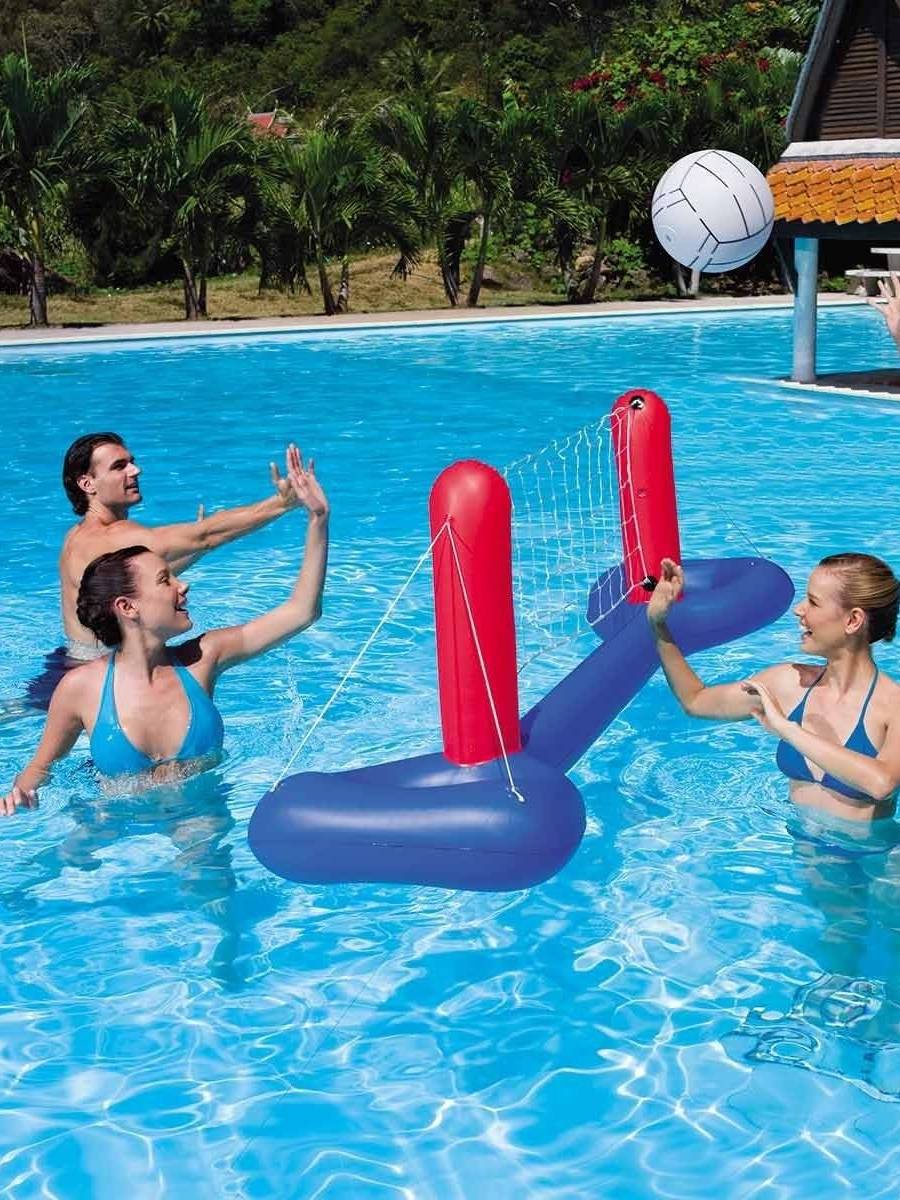 A super-inflated volleyball net floating on a football door and a basketball ball roller
