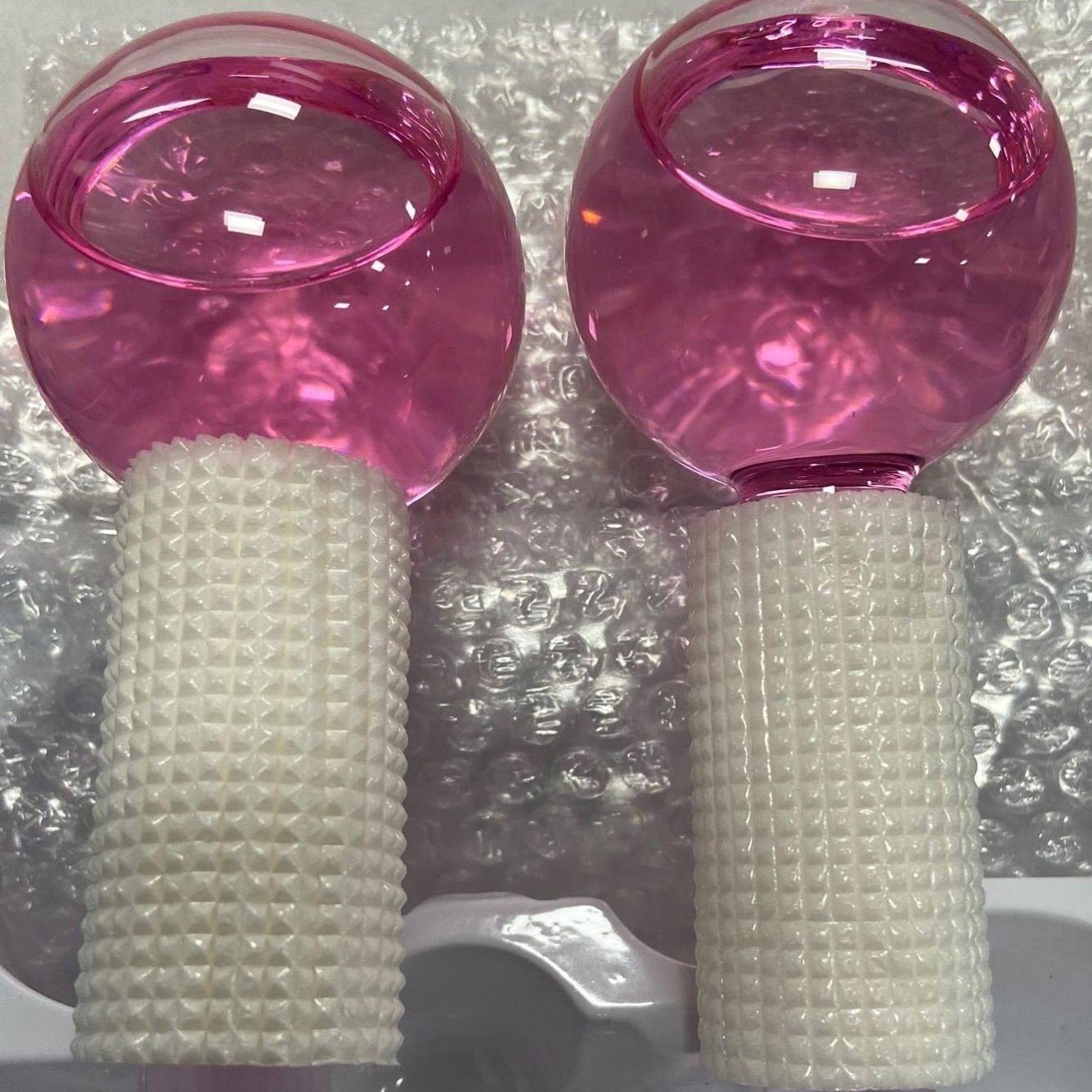 Two pink suits -with a packaging box