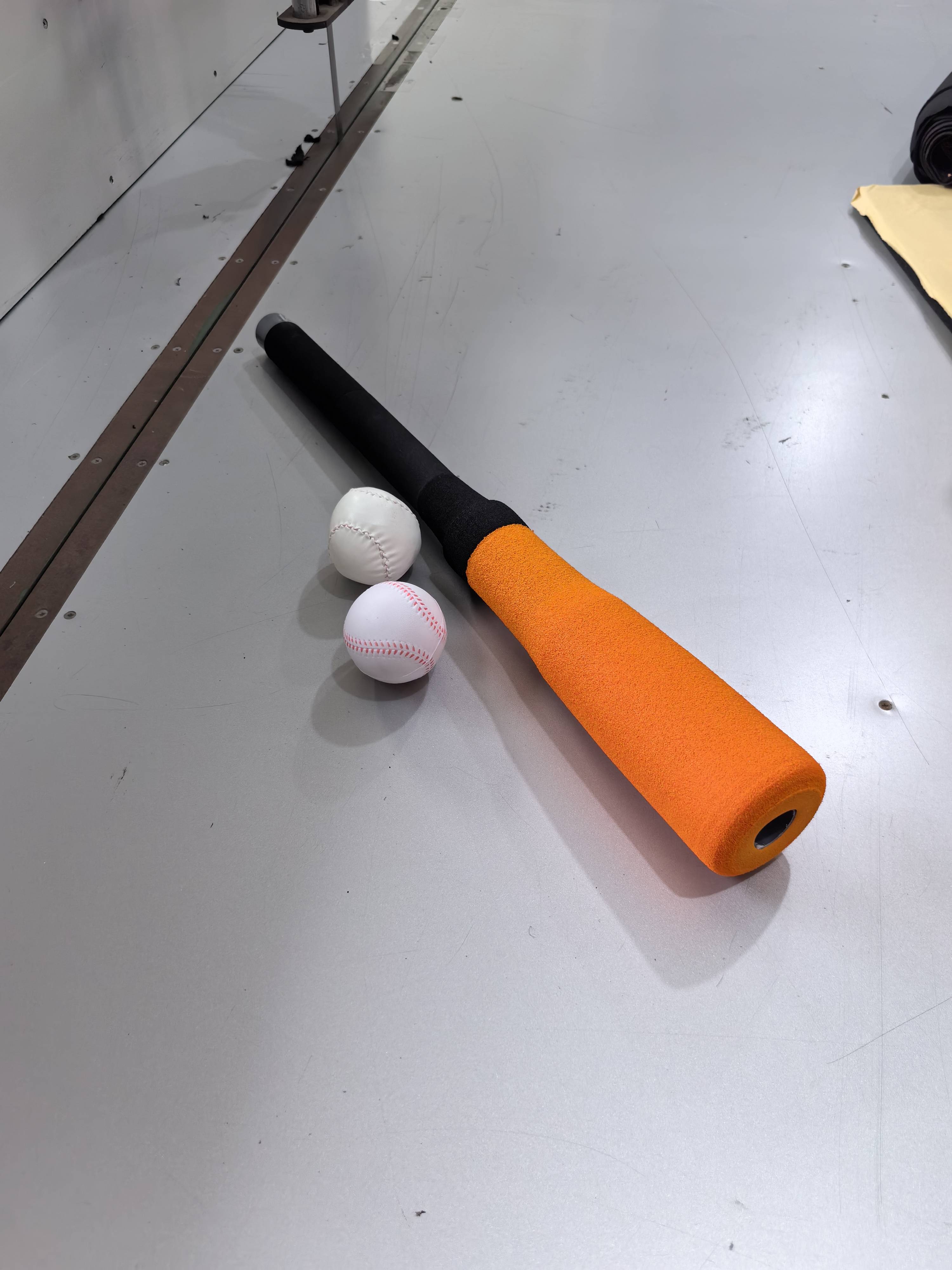Orange 50 cm long baseball stick to get 2 goals