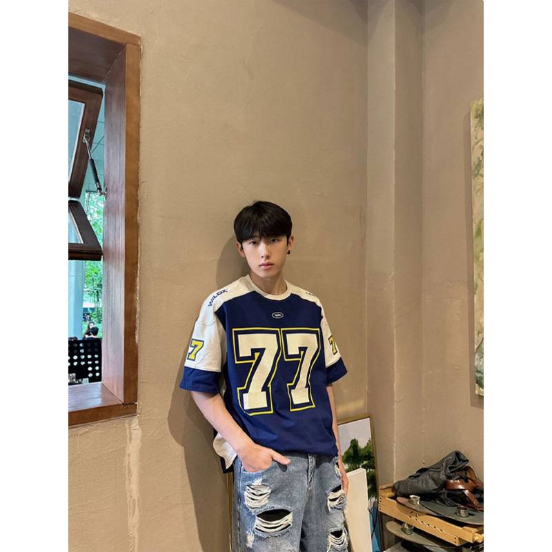 Blue football suit T-shirt guy, vibe pictery 77 O'Malco Street