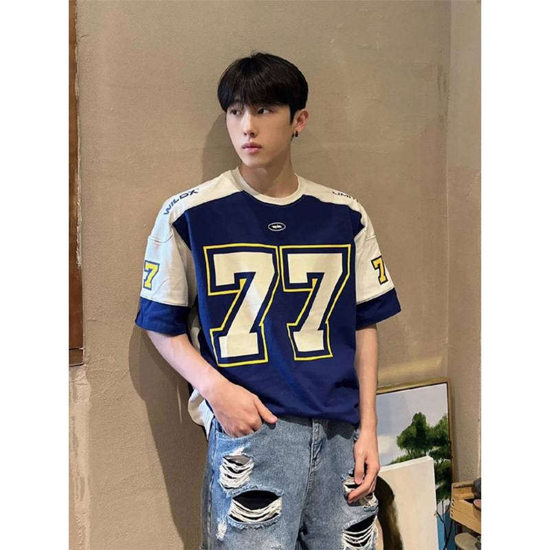 Blue football suit T-shirt guy, vibe pictery 77 O'Malco Street