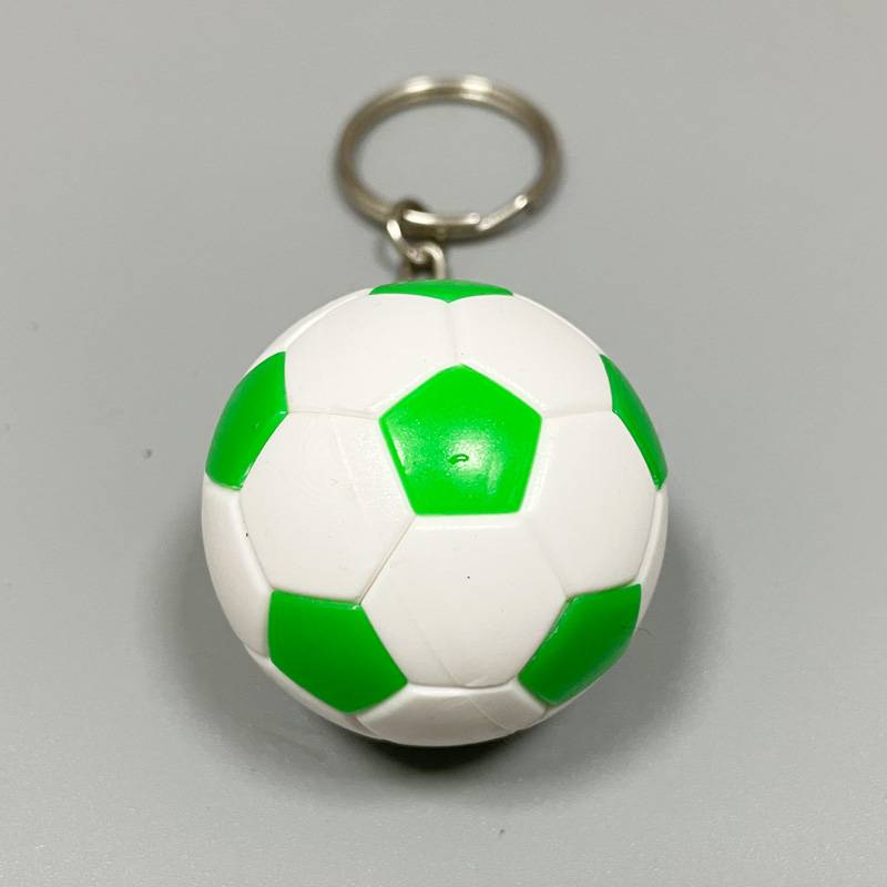 Green and white football keychain