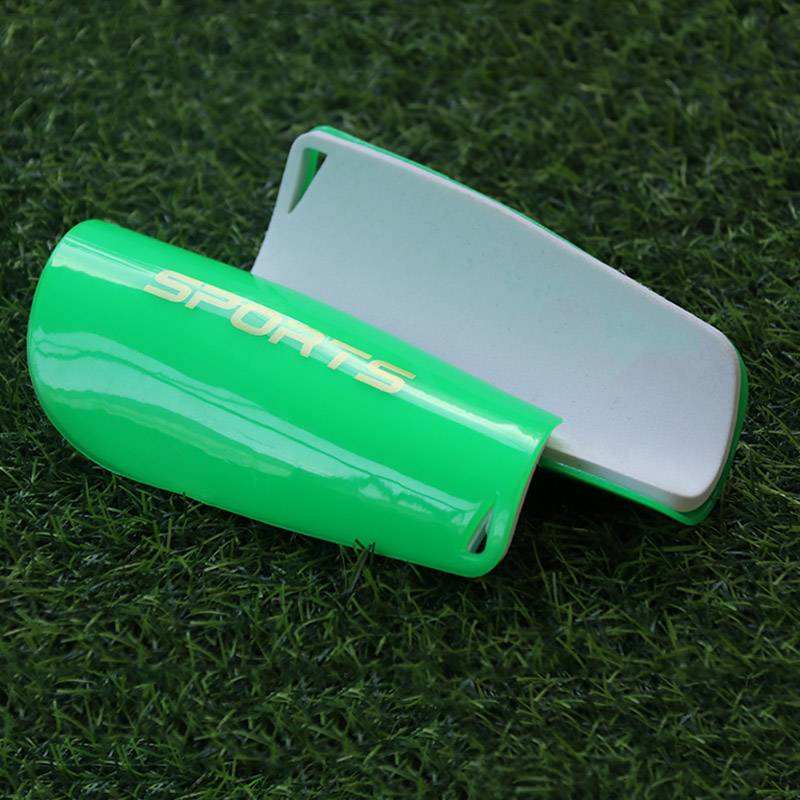 An adult super-light-plug in a football leg-protector kit for a child with a perforated air for a leg plate