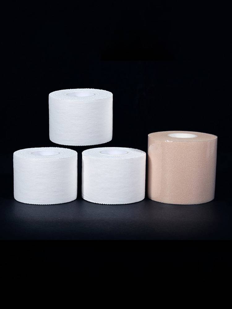 Sporty white duct tape bandages with new football volleyball for ankles