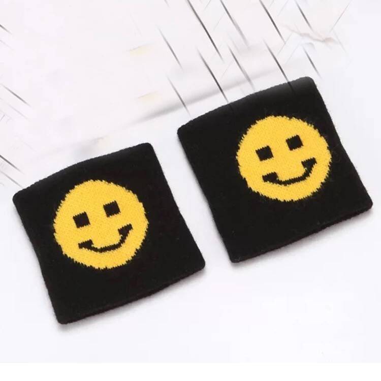 A pair of pure black smiley wrists