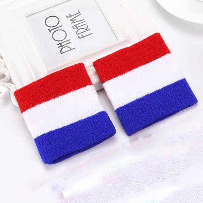 A pair of red and white and blue wrists