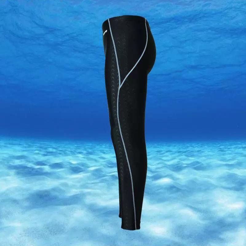 Shark-skin dry-skinned, waterproof-pants-skinned man surfing like a nine-minute long shorts-spaned jellyfish