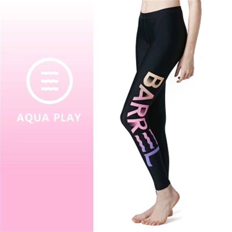 The lady's two-swipe surf shorts are tight and lean, swimming against the sun