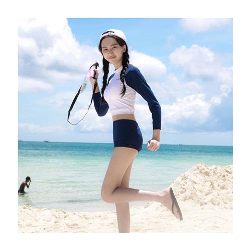 The long sleeves of the sunscreen bathing suit cover the long sleeves of a skinny, conservative swam-diving spa girl