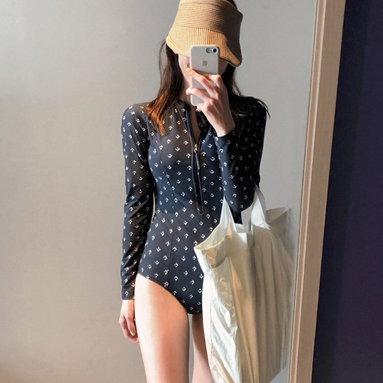 She's got a long tan-proof swimsuit